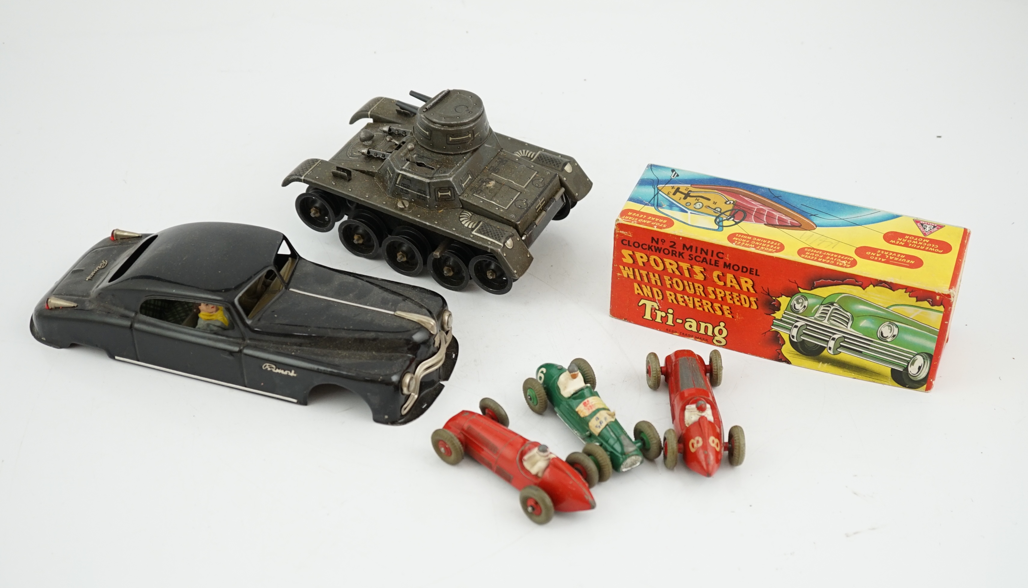 Eleven tinplate and diecast vehicles by Dinky Toys, Tri-ang, Gama, etc., including a Primal Arnold