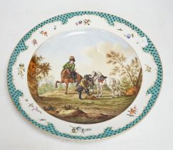 A Meissen style dish decorated with a hunting party, 35.5cm diameter