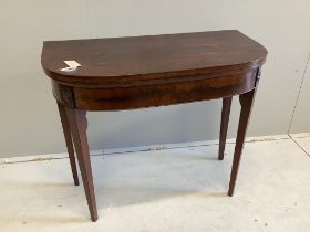A George III mahogany D shaped folding card table, on square tapering legs, width 86cm, depth