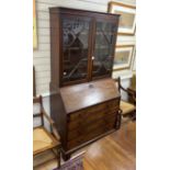 A George III mahogany bureau bookcase, width 107cm, depth 54cm, height 210cm