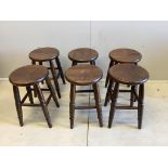 A set of six circular oak stools, diameter 30cm, height 49cm