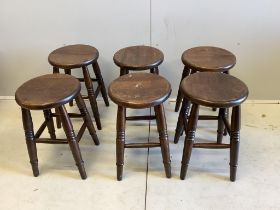 A set of six circular oak stools, diameter 30cm, height 49cm
