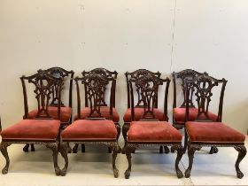 A set of eight Victorian mahogany Chippendale style dining chairs having carved and pierced