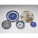 A group of 18th century Chinese porcelain plates and saucers, mostly blue and white and an octagonal