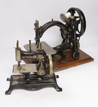 A Victorian Wilcox and Gibbs sewing machine and a smaller sewing machine, 28cm high