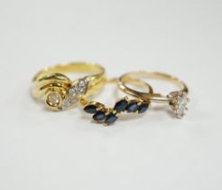 Three assorted modern 14k and gem set rings, including single stone marquise cut diamond, diamond
