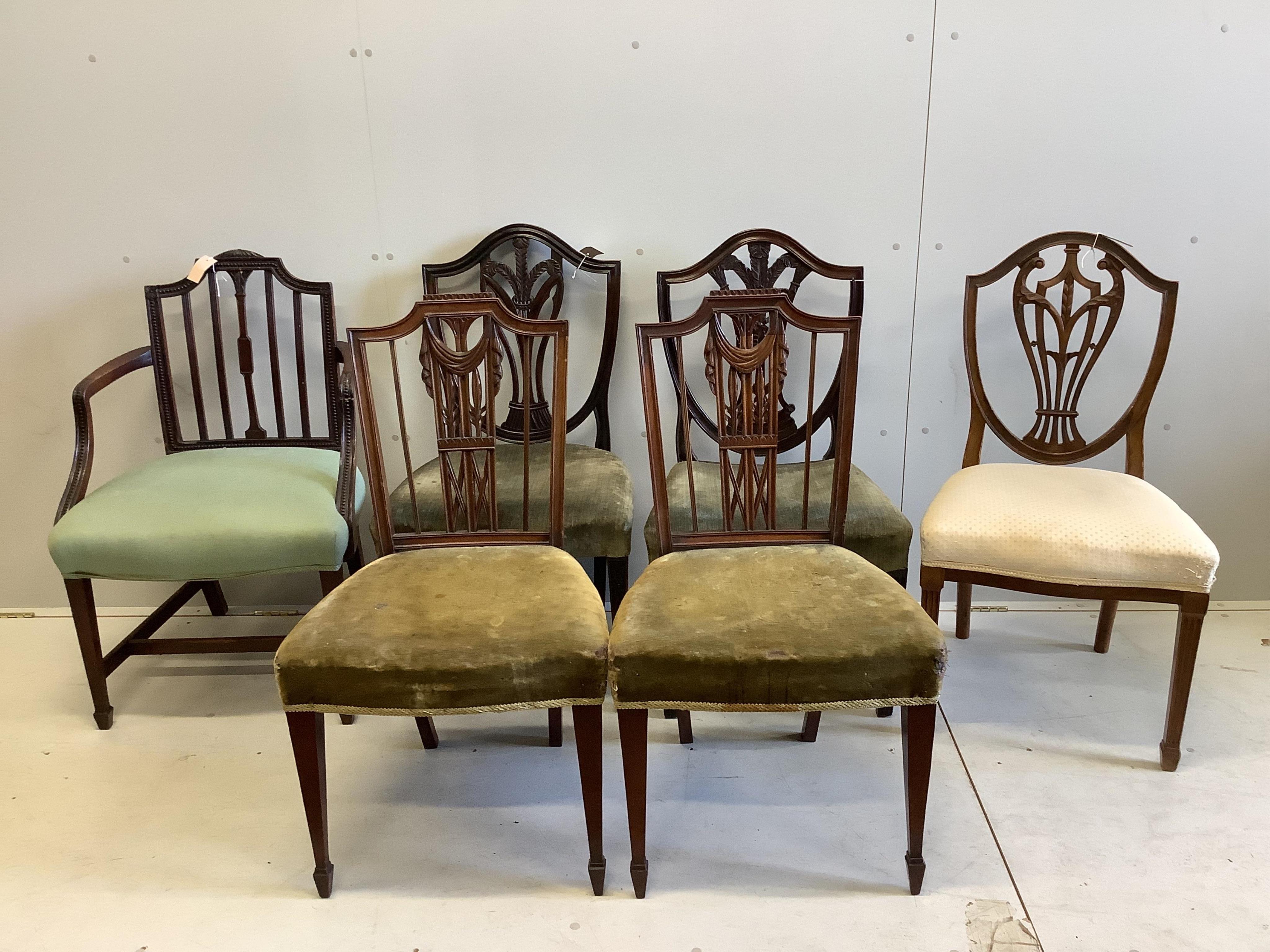 Two Hepplewhite period mahogany dining chairs, a 19th century Sheraton design elbow chair, a pair of