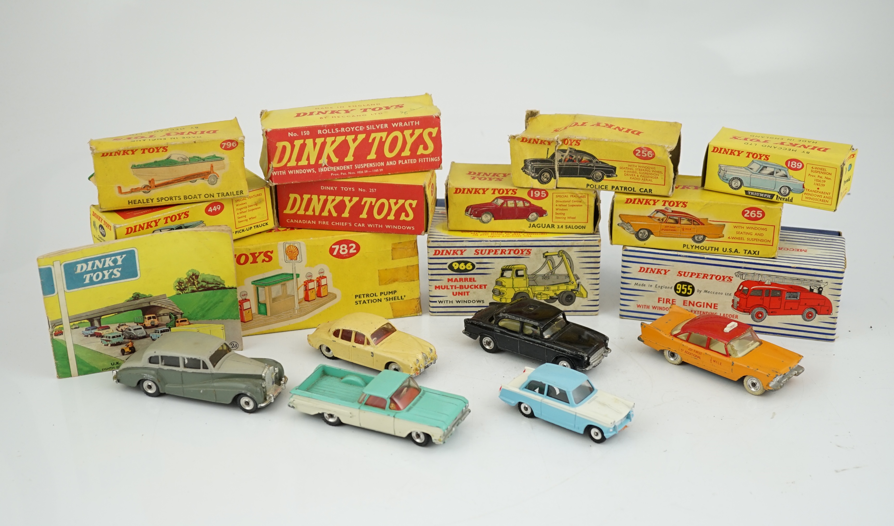 Eleven boxed Dinky Toys; a Triumph Herald (189), a Plymouth U.S.A. Taxi (265), a Chevrolet ‘El