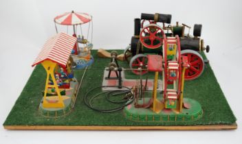 A Wilesco live steam fairground diorama, comprising a D430 pellet fired traction engine, powering