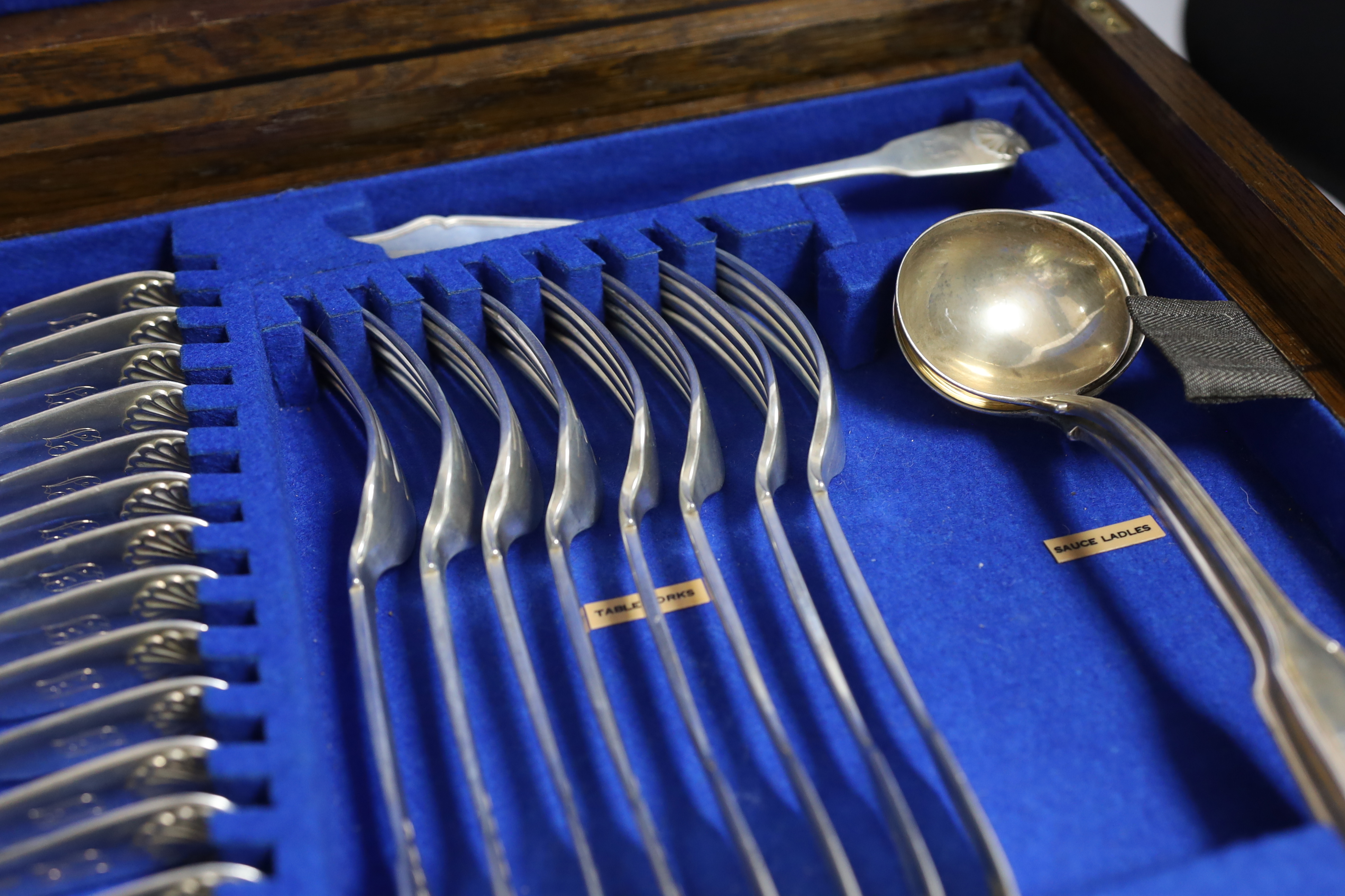 A Victorian oak cased matched canteen of silver fiddle and shell pattern flatware, by John & Henry - Image 7 of 10