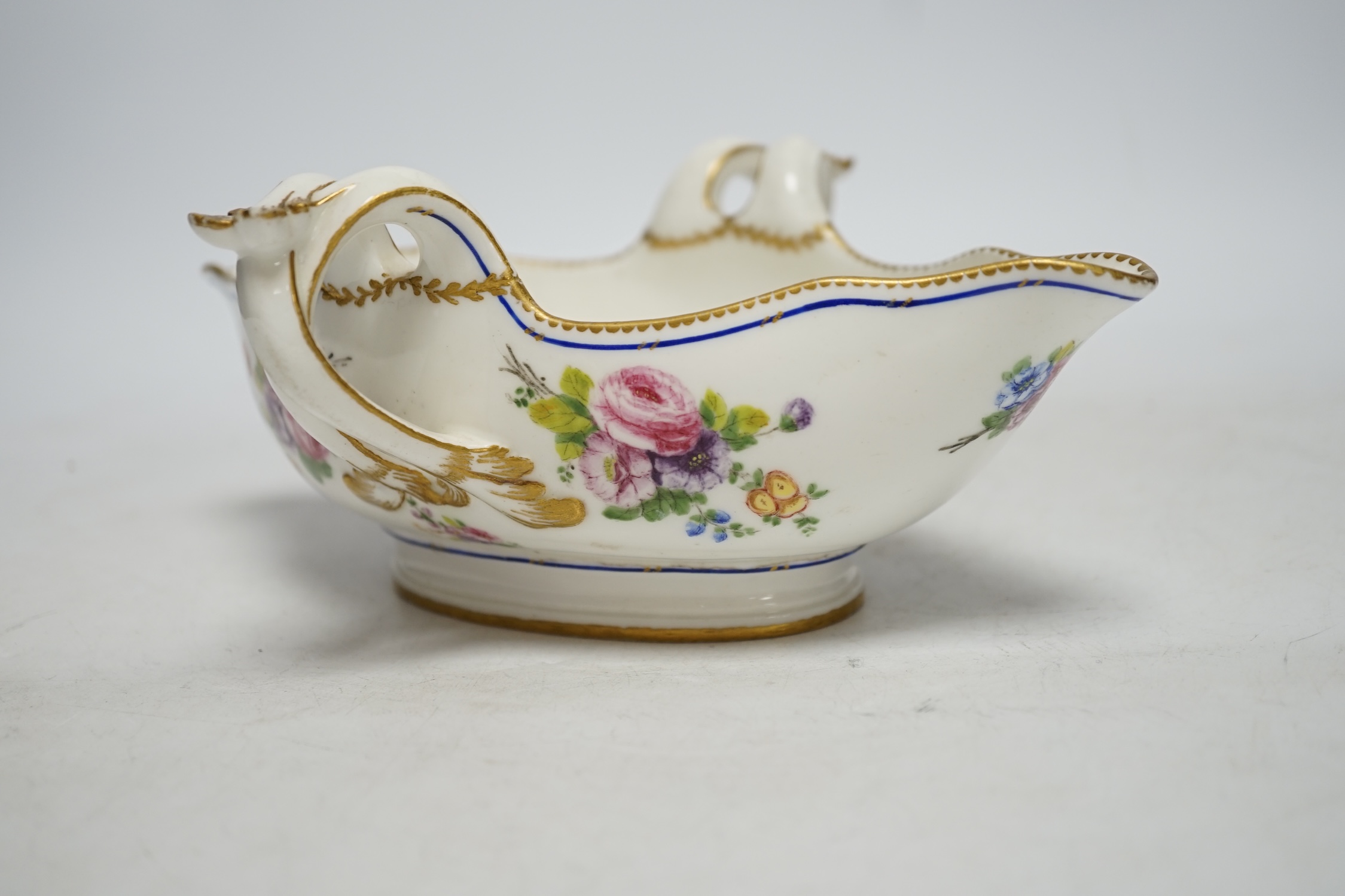 An 18th century Sevres sauceboat, probably later enamelled with flowers, 23.5cm wide - Image 4 of 5