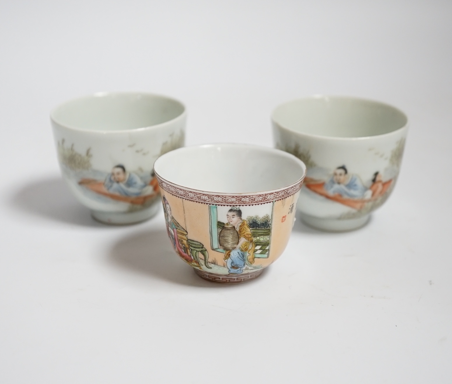 Three Chinese enamelled porcelain tea bowls, largest 5cm high