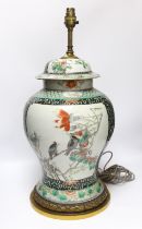 A Chinese famille verte porcelain baluster vase and cover, 19th century, decorated with birds