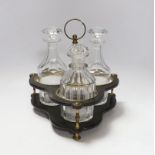 A Regency decanter stand holding three associated cut glass decanters, 24cm