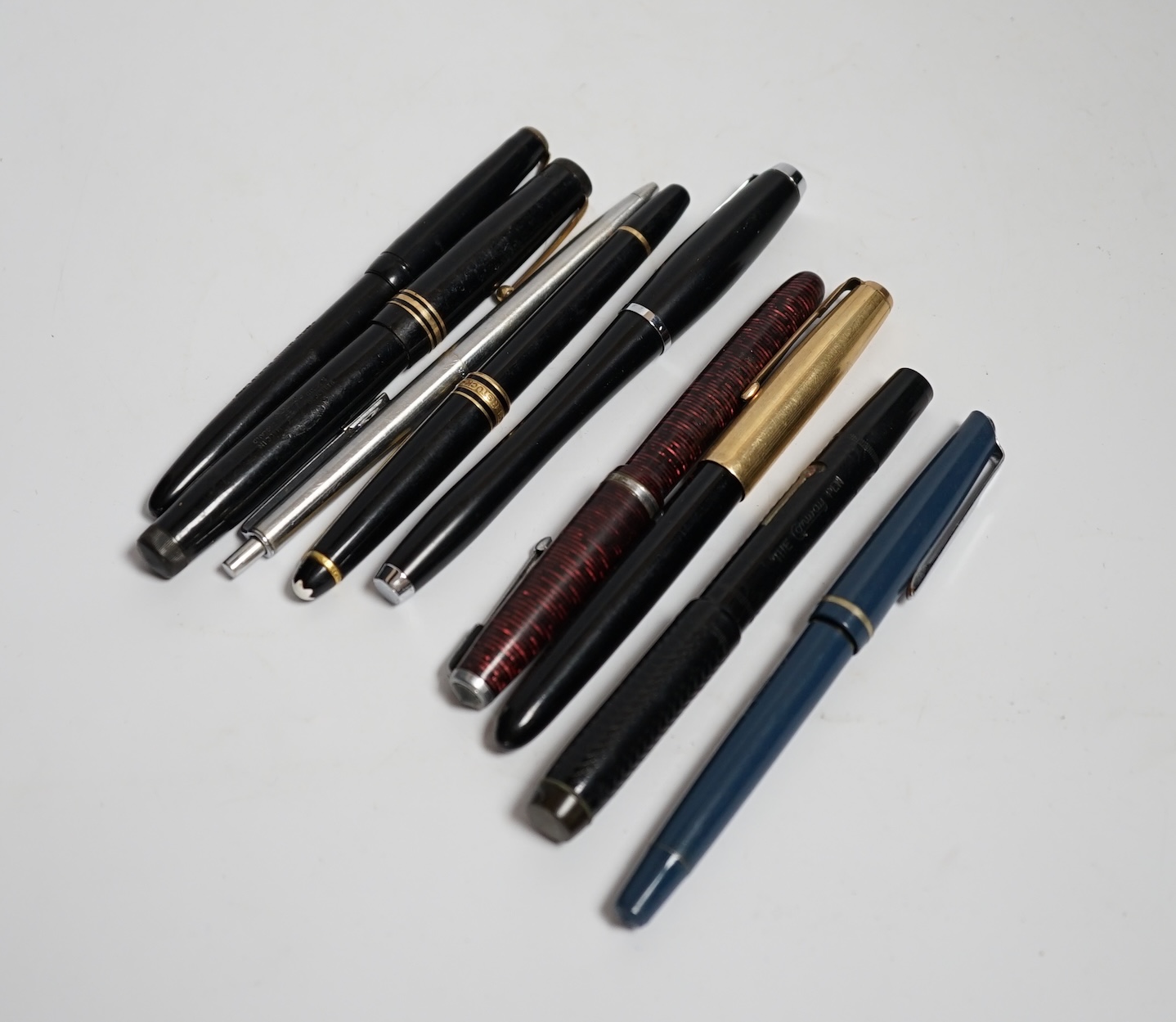 A Montblanc Meisterstuck fountain pen and a quantity of mostly Parker pens