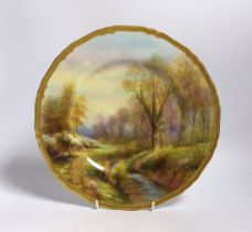 A Royal Worcester cabinet plate, hand painted with a landscape, signed Rushton, 27cm in diameter