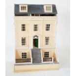 A large modern Georgian style dolls house and extensive contents, with eight fully decorated rooms
