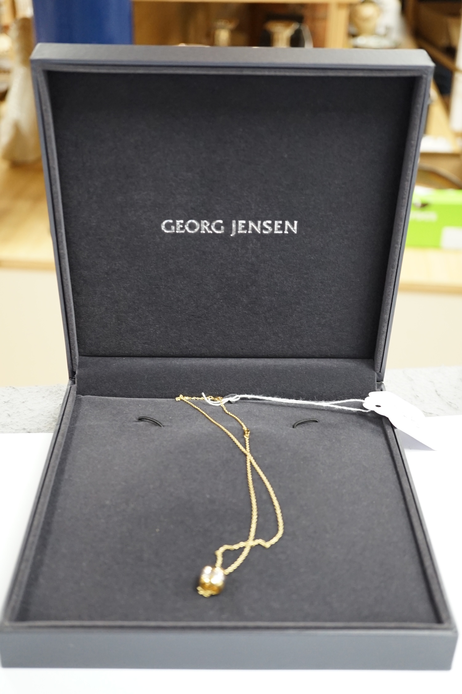 A modern Georg Jensen two colour 18ct gold barrel pendant, 10mm, on a Georg Jensen 18ct gold fine - Image 3 of 3