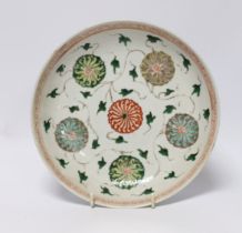 A Chinese famille verte ‘lotus flower’ dish, Kangxi period, 23cm diameter