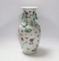 A Chinese famille rose vase, 20th century, with a drilled base, intended to be converted to a