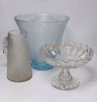 A large heavy cut glass tazza with shaped rim, a tall blue tinted textured vase, height 31.5cm and a