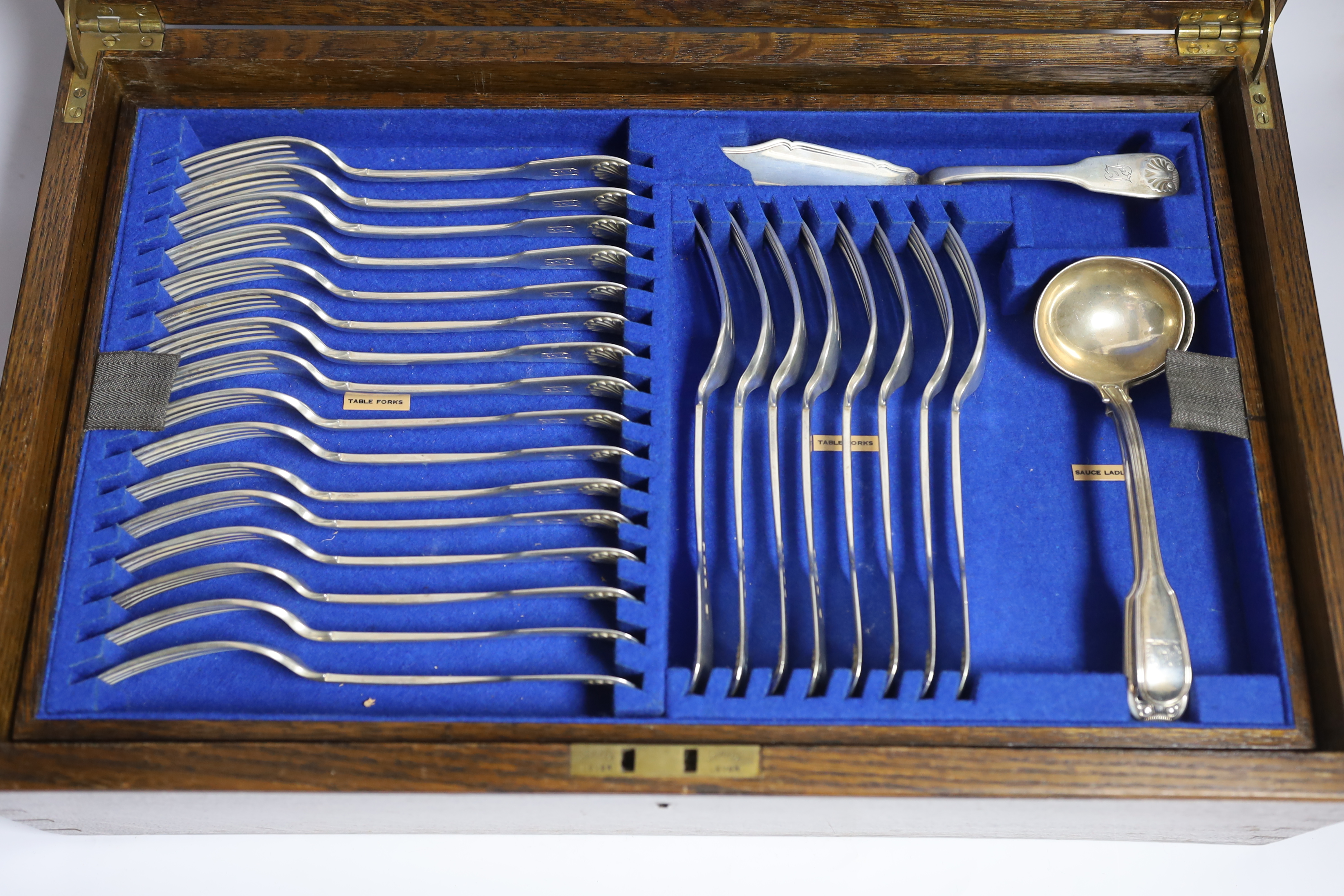 A Victorian oak cased matched canteen of silver fiddle and shell pattern flatware, by John & Henry - Image 5 of 10