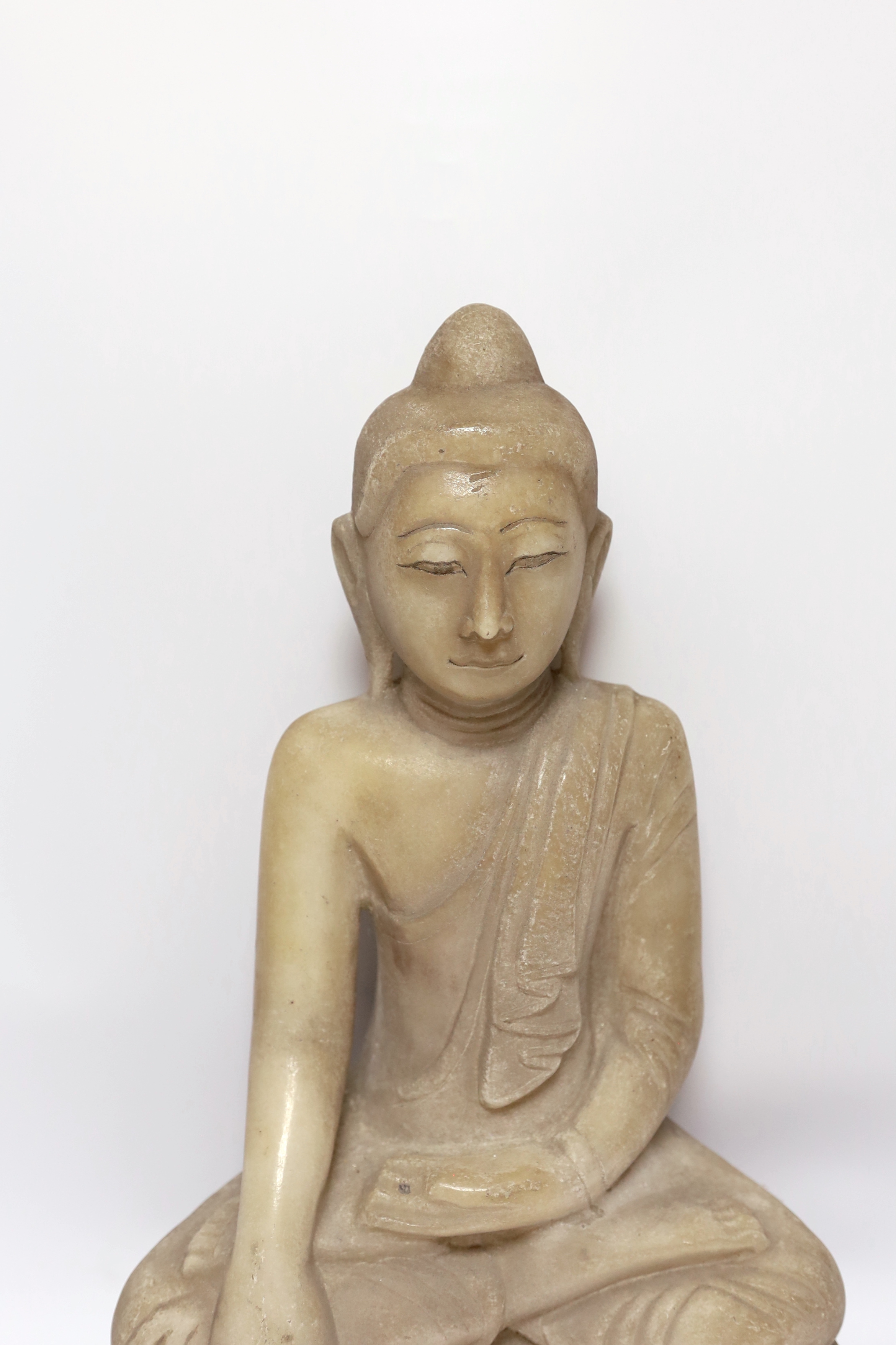 A Burmese carved alabaster model of a seated buddha, 46cm - Image 2 of 4