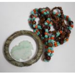 Two Chinese hardstone necklaces, a carved bangle and a jade carving, bangle 8.5cm in diameter