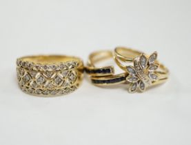 Three assorted modern 18k and gem set rings, including two diamond chip clusters, gross weight 8.2