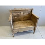 A Victorian style panelled pine settle, width 105cm, depth 60cm, height 110cm