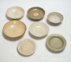 A group of seven Chinese Ding type, qingbai and celadon dishes, Song-Yuan dynasty, largest 15.5cm