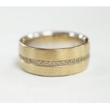 A two colour base metal band, with central row of simulated diamonds, size O.