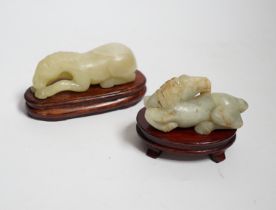 Two Chinese carved jade figures of horses on stands, largest 11cm wide