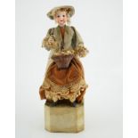 A German automaton of a flower seller, 39cm high