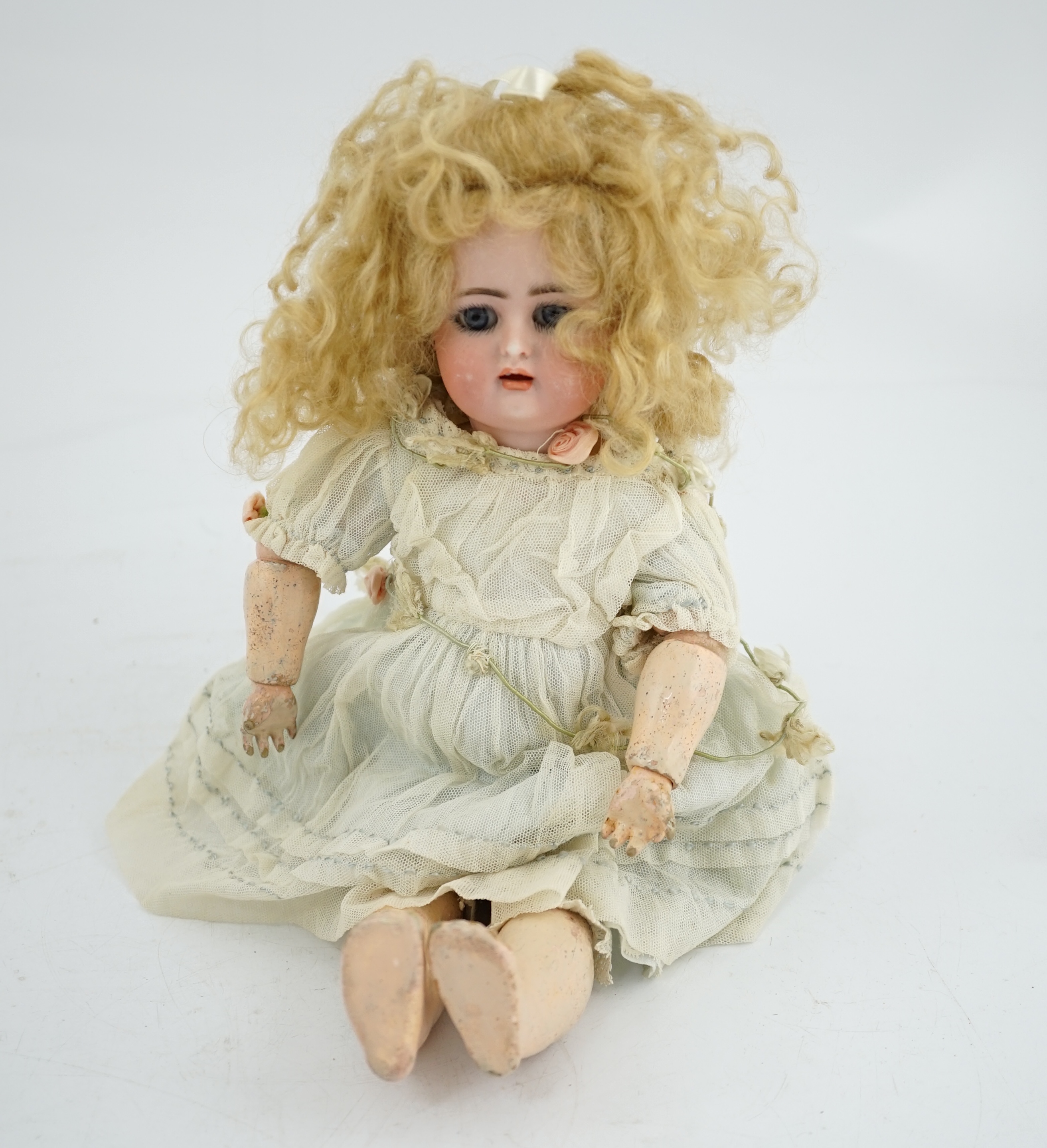 A Kammer & Reinhart / S & H bisque head doll, pierced ears, vintage clothes, one finger missing,