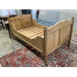 A 19th century Continental pine single bed frame, width 110cm, length 199cm, height 99cm