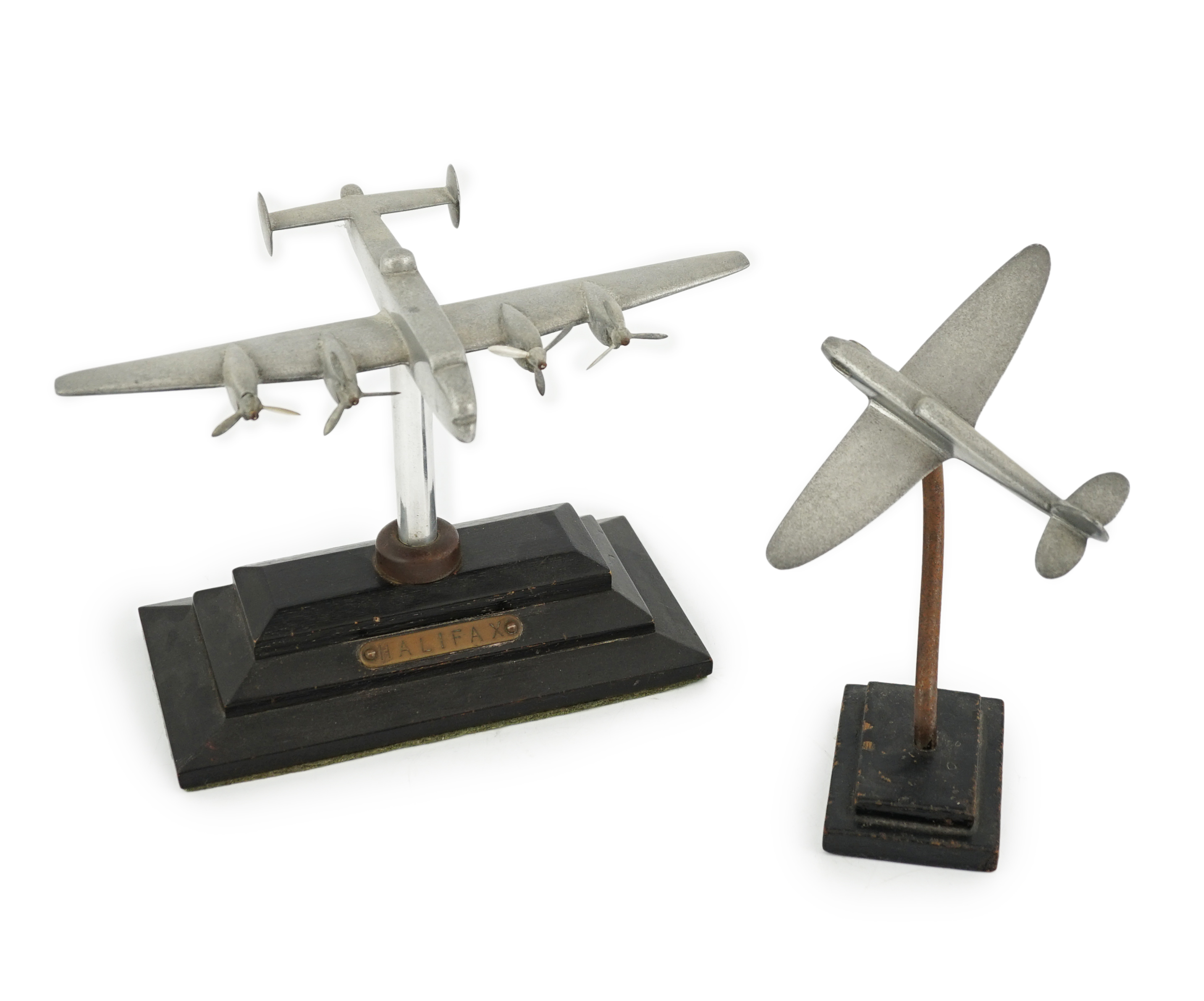 Two cast aluminium military aircraft models mounted on stepped wooden bases; a Halifax bomber,