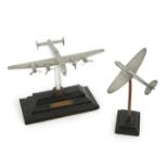 Two cast aluminium military aircraft models mounted on stepped wooden bases; a Halifax bomber,