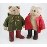 An early Paddington bear, green jacket, missing hat, and a similar Paddington with Dunlop boots, red
