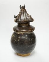 A Khmer brown glazed jar and cover, Cambodia, 12th century, 18cm