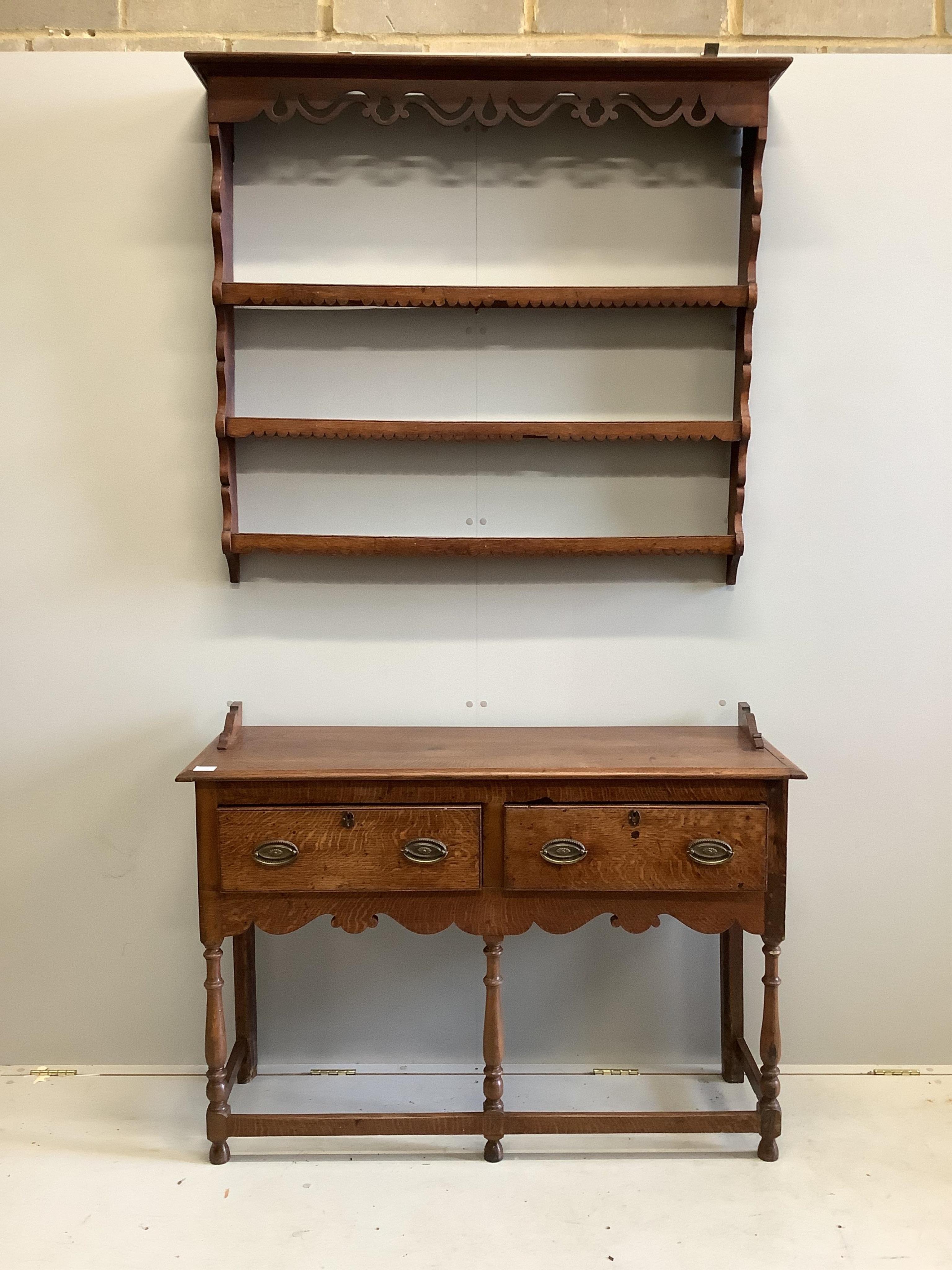 A George III style oak dresser, of small proportions, fitted with twin drawers and shaped apron, - Bild 2 aus 2