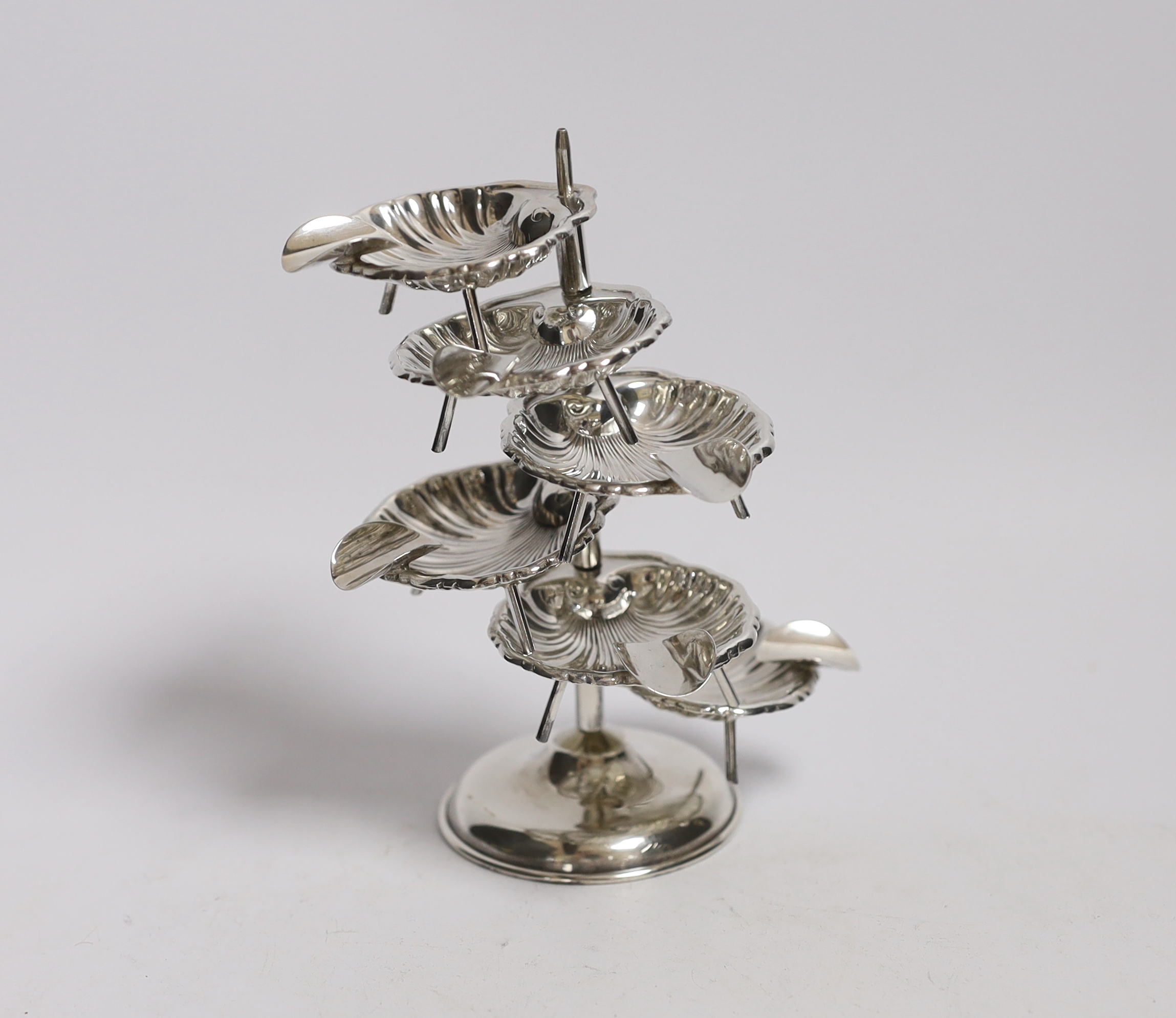 A Mexican 925 sterling ashtray stand, with six detachable shell shaped 925 sterling ashtrays,