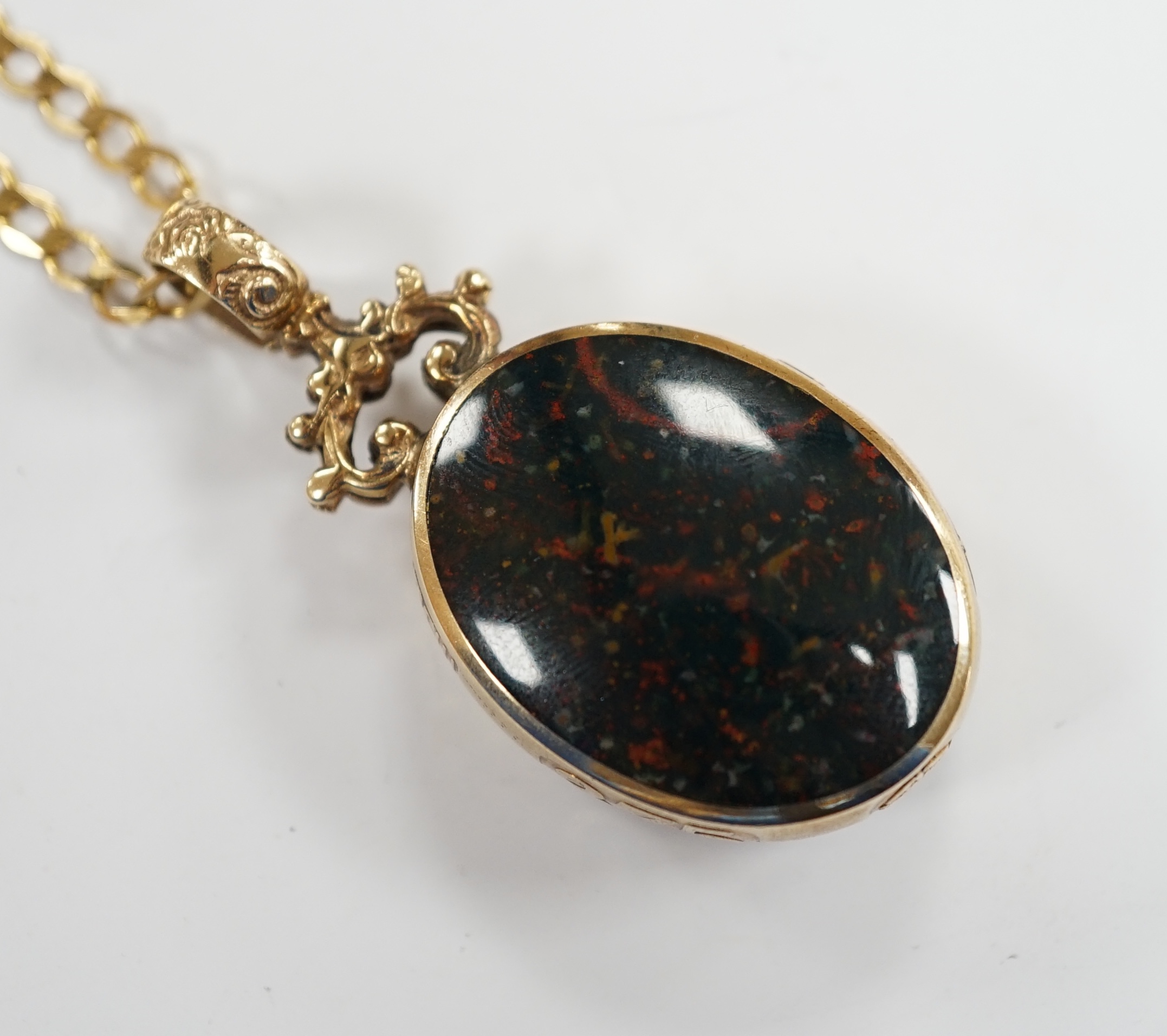 A modern 9ct gold mounted carnelian and bloodstone set oval 'Millennium' pendant, by Davis Scott