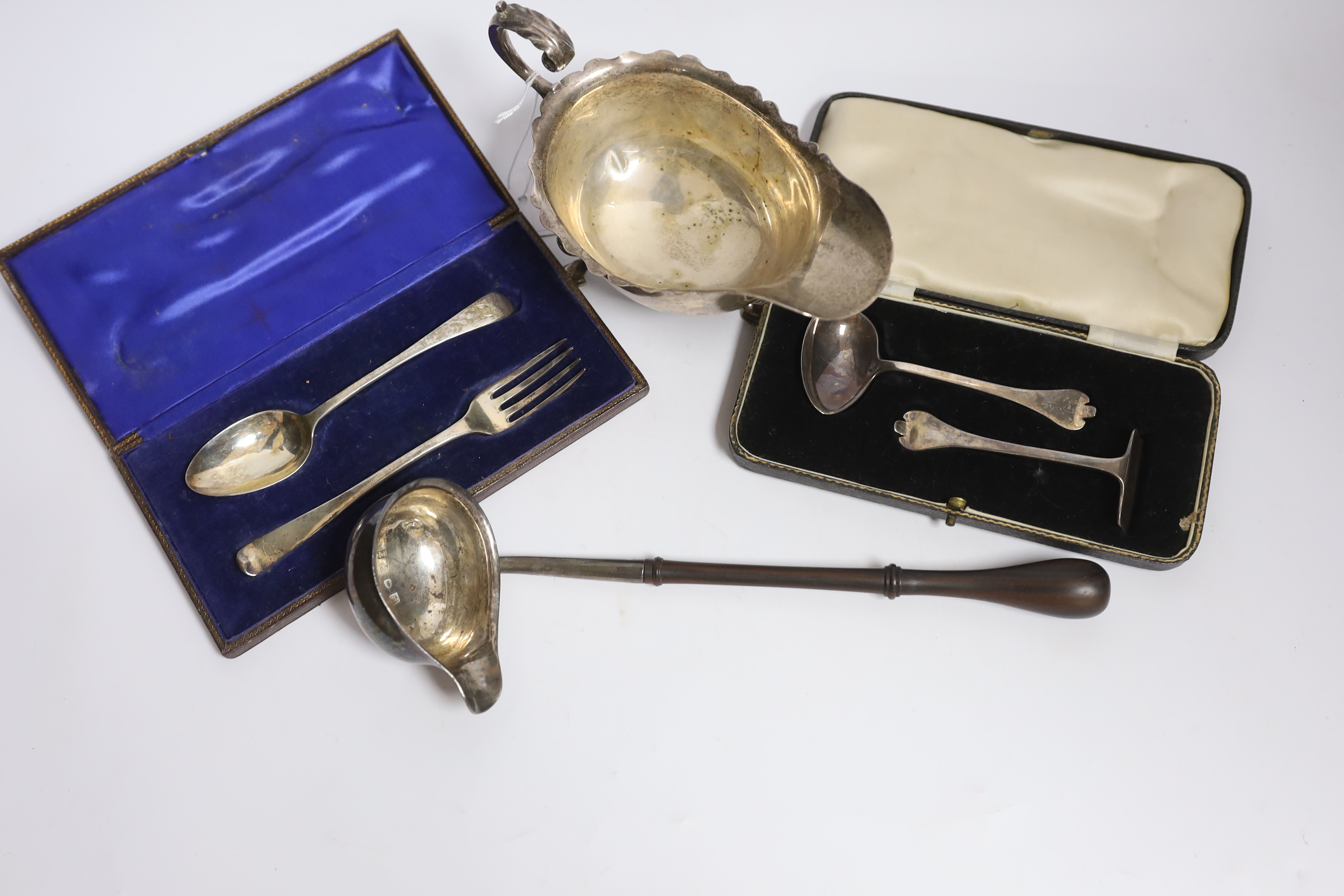 A small group of silver items to include a George V sauceboat, London, 1934, a George III toddy - Image 2 of 3