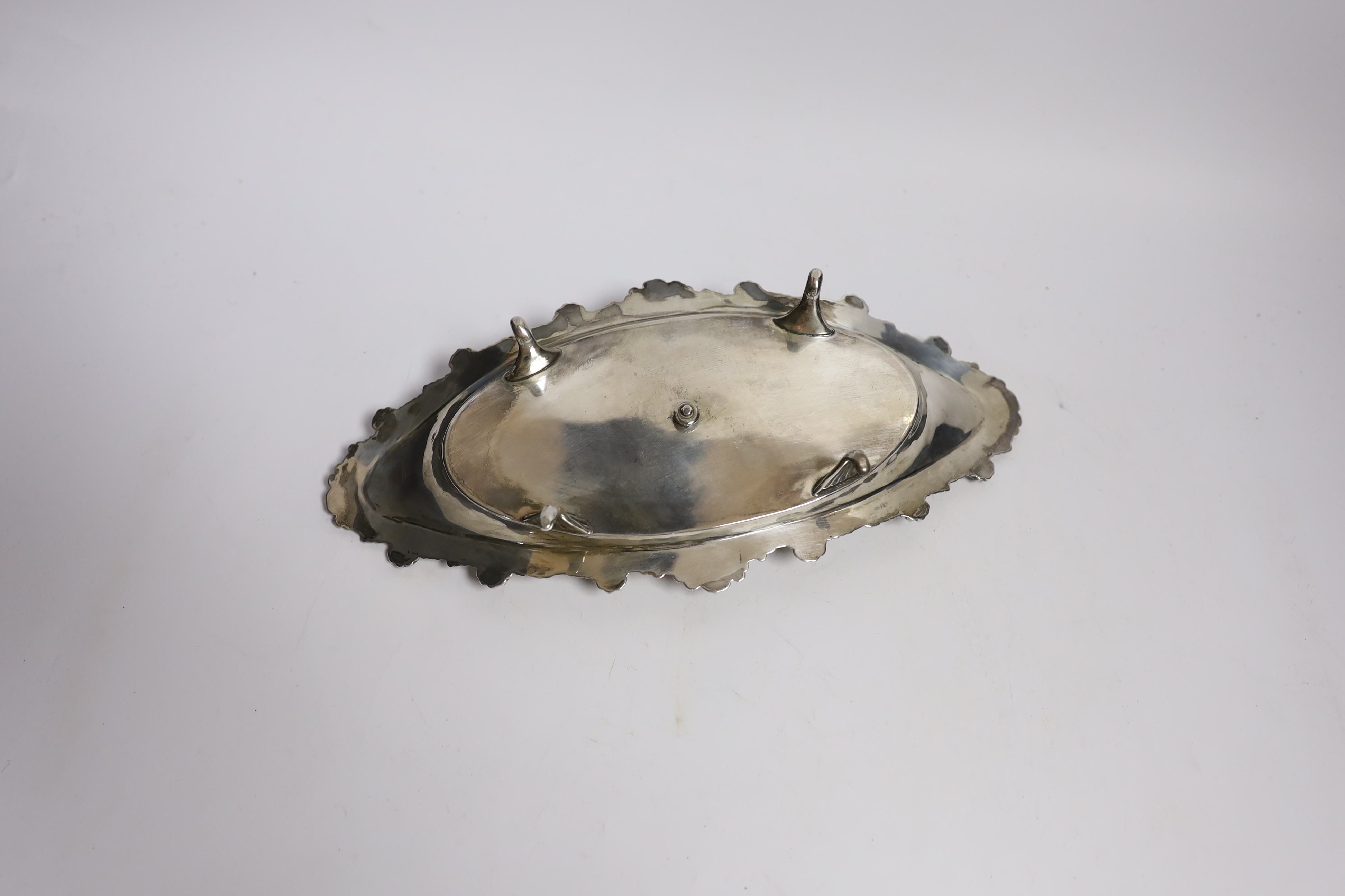 A late Victorian silver navette shaped inkstand, with silver mounted cut glass well, on four - Image 3 of 4