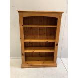 A reproduction pine open fronted bookcase, width 84cm, depth 34cm, height 122cm