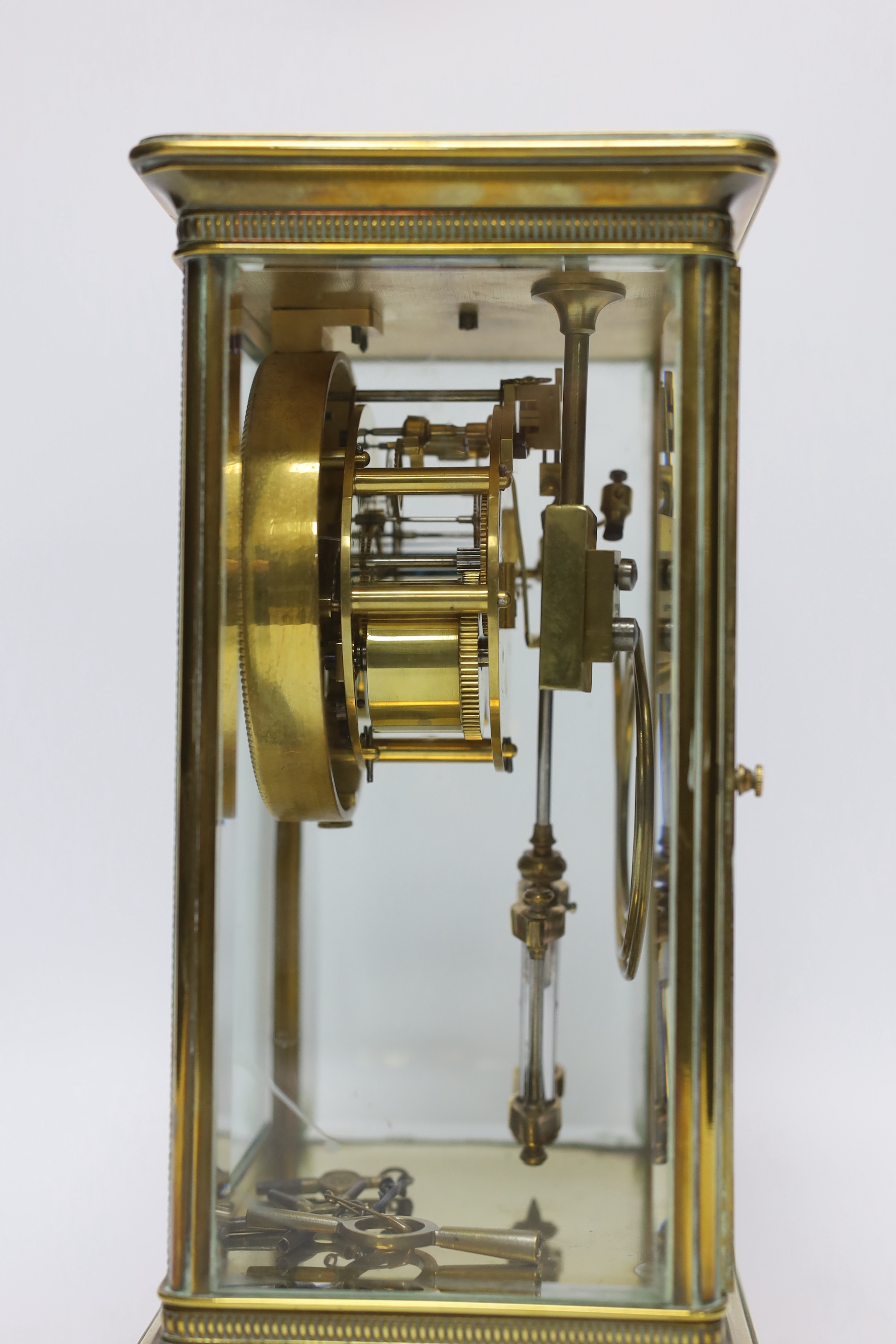 A late 19th century four glass brass clock with key and pendulum, 27cm - Image 2 of 3