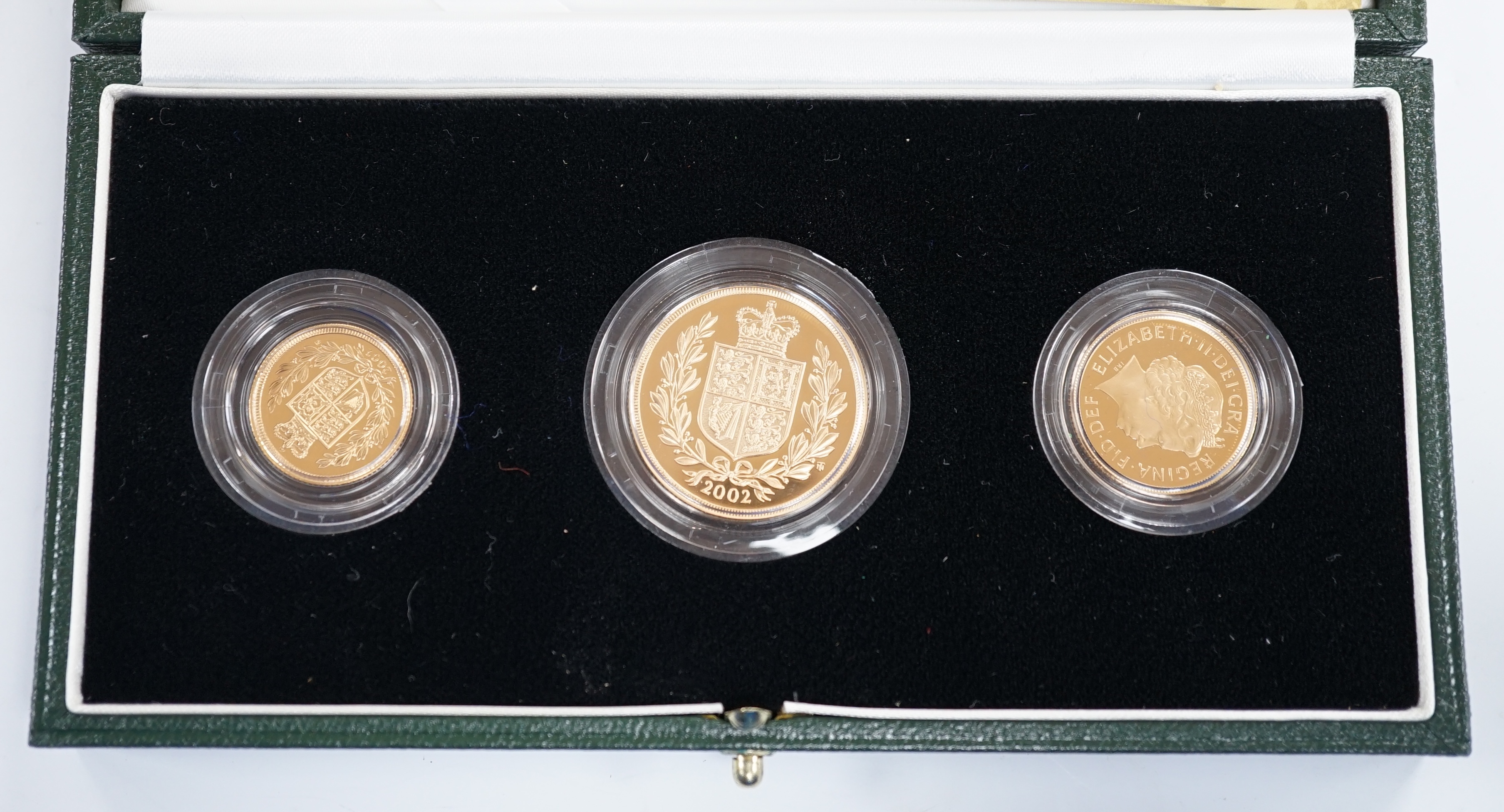 A cased 2002 United Kingdom gold proof sovereign three coin collection, with certificate.