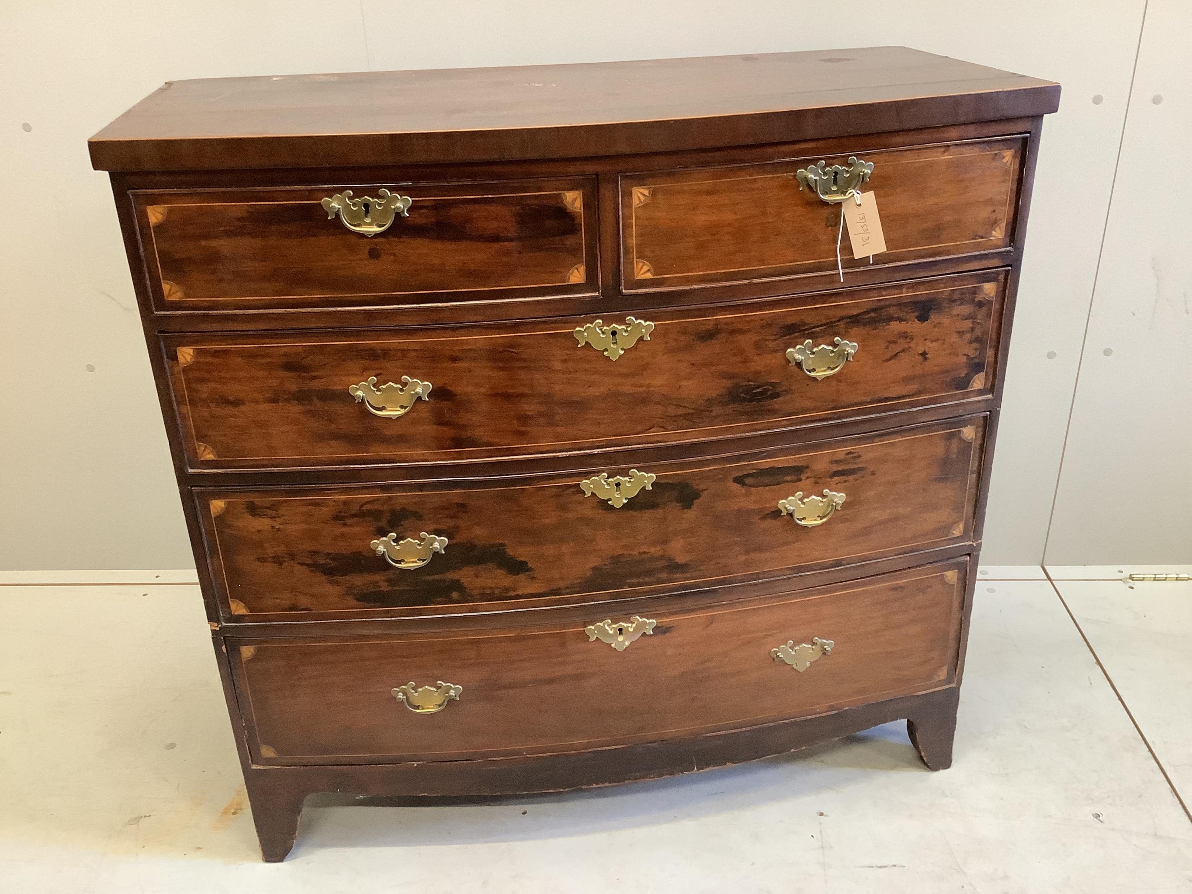 A late Georgian mahogany bowfront chest fitted two short and three long drawers, line and fan inlay,