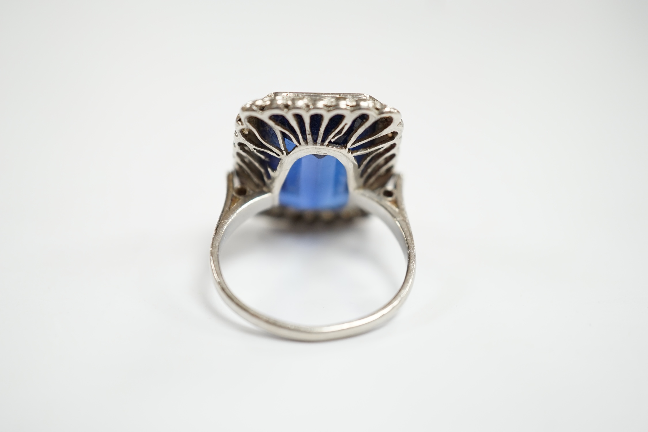 A 1920's white metal and single stone emerald cut synthetic sapphire set dress ring, with millegrain - Image 4 of 5
